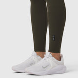 W072 LYCRA® ADAPTIV 4 Pocket Legging in olive worn with white sneakers, lower body view