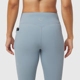Light Sky LYCRA® ADAPTIV 4 Pocket Legging worn by model, back view showing side pocket
