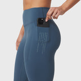 W072 LYCRA® ADAPTIV 4 Pocket Legging in storm blue, worn with phone in pocket, side view