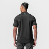 Core Mock Neck Tee in black, worn by model shown from behind