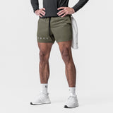 Tetra-Lite 5" Linerless Shorts in olive with reflective ASRV branding, worn by model with hands on hips