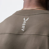 Core Mesh Oversized Tee in Deep Taupe worn by model, back view showing ASRV logo