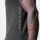 Core Mesh Established Tee in space grey worn by model, side view showing tattoo and mesh detail