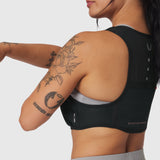 1080 Run Pack sports bra in black, back view on model