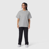 Heather grey relaxed tee worn with black joggers and white sneakers, front view