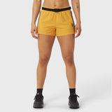 Yellow athletic shorts with black belt on model, front view