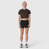 AeroSilver Cropped Tee in dark earth worn with black shorts, front view