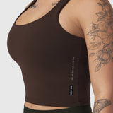 LYCRA® 2-in-1 Tank Top in dark brown, worn by model showing side view with tattoos visible