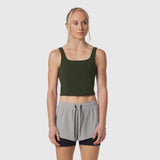 Olive LYCRA® 2-in-1 tank top worn with gray shorts, front view on model