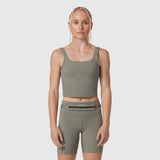 W022 Lycra 2-in-1 tank top in sage, worn by model, front view
