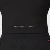 Black Lycra ribbed mockneck tank worn on model, front view showing 'Relentless Pursuit' text