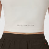 LYCRA® Ribbed Mockneck Tank in ivory cream worn with black shorts, front view