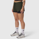 Tetra-Lite Liner Short in olive with black undershorts, modeled with white socks and trail sneakers