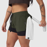 Tetra-Lite Liner Short in olive worn by model, holding white shorts, side view