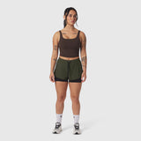 Tetra-Lite Liner Short in olive with black underlay, worn with brown crop tank top
