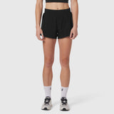 Aerotex Side Split Run Short in black, worn by model with white socks and athletic shoes, front view