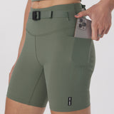 LYCRA® 3-in-1 Biker Short in sage worn by model, holding phone in pocket