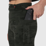 W030 Lycra 3-in-1 legging in dark camo, worn by model holding phone in pocket
