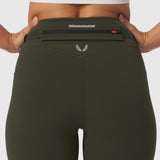 W030 LYCRA® 3-in-1 Legging in olive, worn by model showing waistband detail