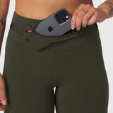 W030 Lycra 3-in-1 legging in olive worn by model, demonstrating pocket detail with phone
