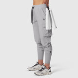 Tetra-Lite Cargo High Rib Jogger in slate grey, worn with towel accessory, side view