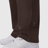 Dark Earth Sorona® Terry straight leg sweats on model wearing white sneakers, cropped view