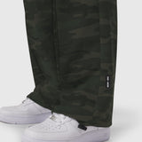 W036 Ripstop Relaxed Track Pant in Dark Camo worn with white sneakers, lower body view