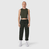W036 Ripstop Relaxed Track Pant in dark camo, worn with olive crop tank top and white sneakers