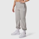 W036 Ripstop Relaxed Track Pant in slate grey, worn with white socks and sneakers, front view