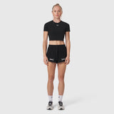 W037 Tetra-Lite Linerless Short in black with bracket logo, worn by model, front view