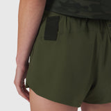 Tetra-Lite Linerless Short in olive, worn by model, side view