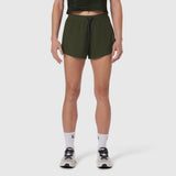 Tetra-Lite Linerless Short in olive, worn by model with white socks and sneakers