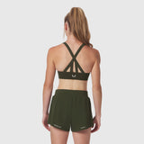 LYCRA® Hybrid Sports Bra in olive, back view on model showing strappy back design