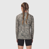 Polartec Delta longsleeve in digital camo, back view on model with braided hair