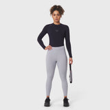 Black LYCRA® ADAPTIV baselayer longsleeve worn with grey leggings, front view