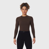 LYCRA® ADAPTIV Baselayer Longsleeve in Dark Earth, worn with black leggings, front view