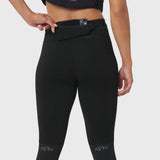 W059 Hybrid Belt-Pack Run Legging in black, worn by model showing waistband with phone holder pocket