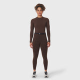 W059 Hybrid Belt-Pack Run Legging in dark earth, worn by model standing facing camera
