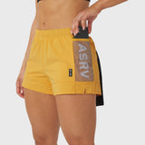 Tetra-Lite Adventure Short in amber yellow, worn by model showing side pocket detail