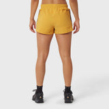 Tetra-Lite Adventure Short in amber, rear view on model wearing black socks and shoes