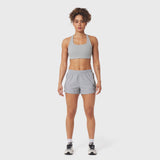 Tetra-Lite Adventure Short in Slate Grey, worn with matching sports bra, front view