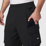 Tetra-Lite® Cargo City Pant in black worn by model, showing cargo pocket detail with phone