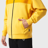 Dri-Core Sidelock Full Zip hoodie in amber yellow, modeled with hand in pocket
