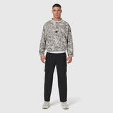 Tetra-Lite Blade Collar Zip Jacket in digital camo, worn with black cargo pants, front view