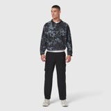 Tetra-Lite Blade Collar Zip Jacket in pixel camo worn with black cargo pants, front view