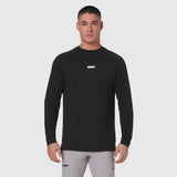Polartec® Delta longsleeve in black, worn by model with gray joggers, front view