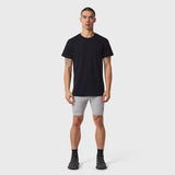 Black Polartec® Delta Training Tee worn with grey shorts and black socks, front view on model