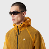 Weather-Ready Transparent Ripstop Shell Jacket in amber, worn by model in profile view