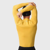 LYCRA® ADAPTIV Baselayer Longsleeve in amber, model wearing with arms raised overhead