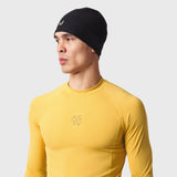 LYCRA® ADAPTIV Baselayer Longsleeve in amber yellow, worn by model facing right